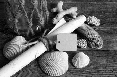 Seashells and glass jar with tag.の写真素材