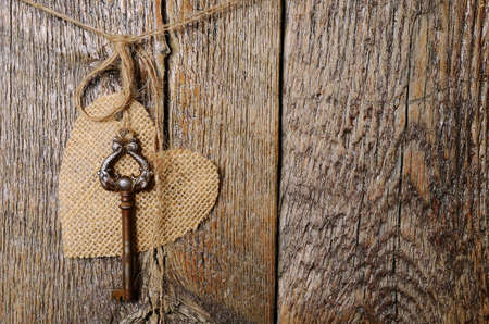 Hanging Canvas Heart with Antique Keyの写真素材