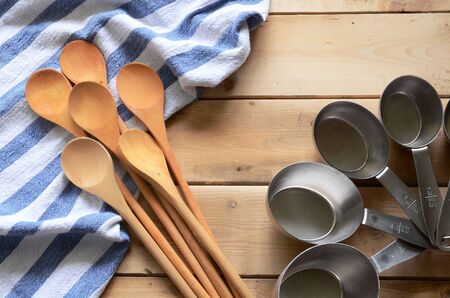 Wooden Mixing Spoons and Blue Dish Towelの写真素材