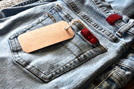 Faded Denim Jeans with Brown Price Tagの写真素材