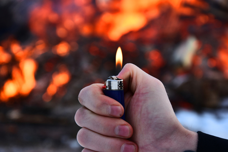 Lit Lighter and Fire Background