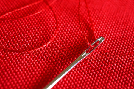 Red Thread and Sewing Needle