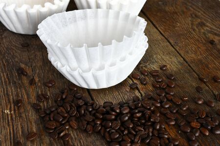 Coffee Filters and Dark Roasted Coffee Beansの写真素材