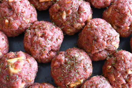 A close up image of several round homemade meatballs.の写真素材