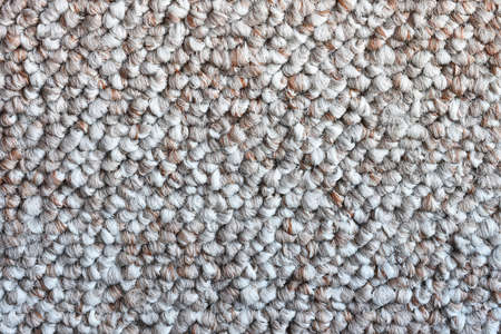 An abstract image of the texture of grey loop carpet.