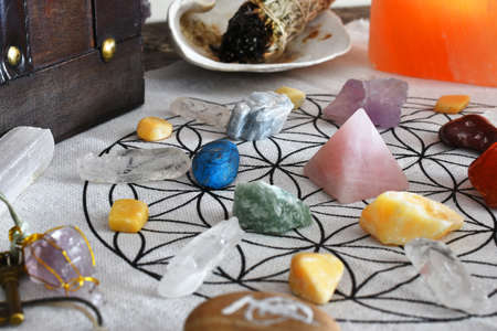 A close up image of a chakra healing grid using a pink rose quartz pyramid and sacred geometry.の写真素材