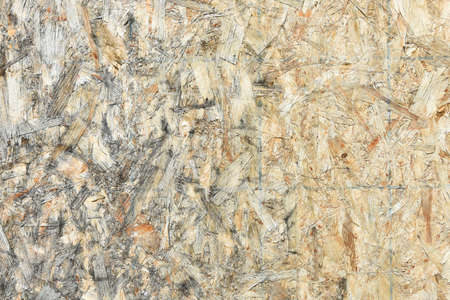 A textural image of old weathered and decaying plywood.