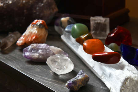 A close up image of a crystal chakra balancing set on a selenite wand.の写真素材