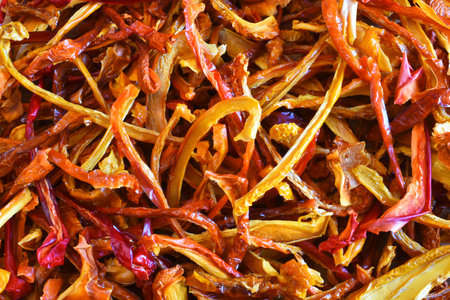 A close up view of dehydrated yellow and red organic peppers.