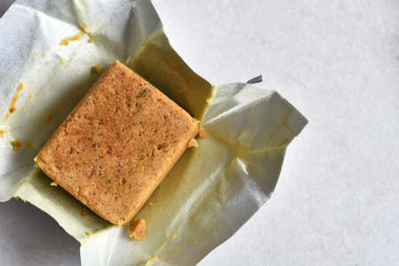 A top view image of a chicken bouillon cube in a silver wrapper.の写真素材