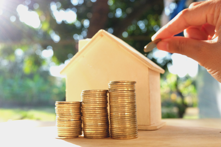 Coins placed on the wooden floor, Business Finance and Money concept, Save money for prepare in the future .Concepts saving money for House.の写真素材