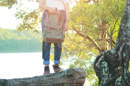 Young girl backpack in nature background, Relax time on holiday concept travel , color of vintage tone and soft focusの写真素材