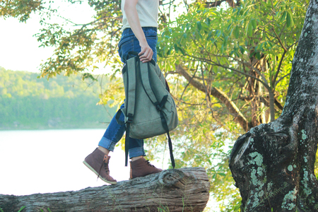Young girl backpack in nature background, Relax time on holiday concept travel , color of vintage tone and soft focusの写真素材