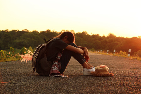 Happy  female with backpack tourist to travel in nature during vacation. Travel concept.の写真素材
