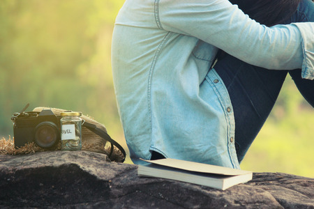 Young woman traveling alone, emotional loneliness , heartbroken ,concept travel, color of vintage tone and soft focus.の写真素材