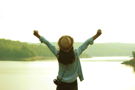 Young woman traveling alone, emotional loneliness , heartbroken ,concept travel, color of vintage tone and soft focus.の写真素材
