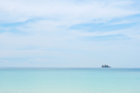 Perfect sky and water of ocean, bokeh sun light wave abstract background.の写真素材