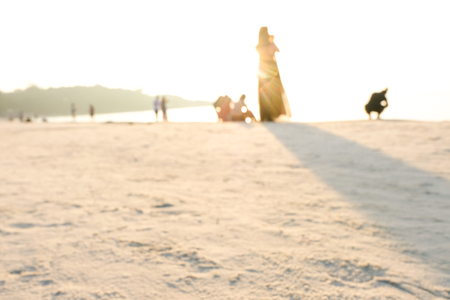 Blur beach with bokeh sun light wave abstract background. Travel concept.の写真素材