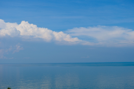 Perfect sky and water of ocean, bokeh sun light wave abstract background.の写真素材