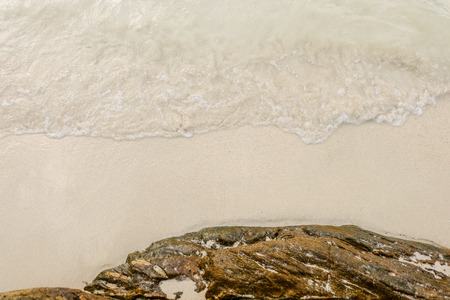 sea horizon with rocky shore cliffs and sun light blue sky background. Sea waves crashing on rocks, Samed, Thailandの写真素材