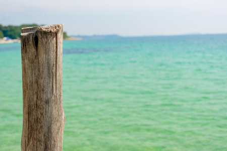 Perspective view of Old wooden bridge extending into the sea. holiday and summer scene.の写真素材