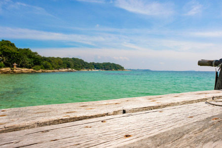 Perspective view of Old wooden bridge extending into the sea. holiday and summer scene.の写真素材