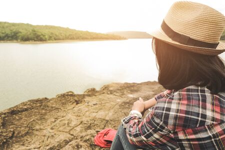 Traveler relaxing with serene view mountains and lake landscapeの写真素材