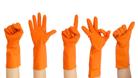 Hands of volunteers in yellow rubber gloves putting up isolated on white background, use clipping path - volunteer concept.の写真素材