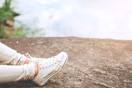 Relaxing moments, Asian young girls with bright backpack enjoying in nature during vacation. Travel Lifestyle adventure concept vacations into the wild. Hipster tone style.の写真素材