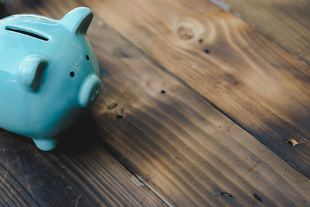 Blue piggy bank on old wooden floor. ideas about saving money for future use - business success concept.の写真素材