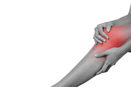 Inflammation colored in red suffering injured leg, healthcare and problem concept - isolated on white background with clipping path.の写真素材
