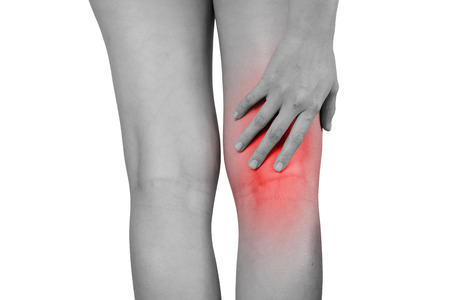 Inflammation colored in red suffering injured leg, healthcare and problem concept - isolated on white background with clipping path.の写真素材