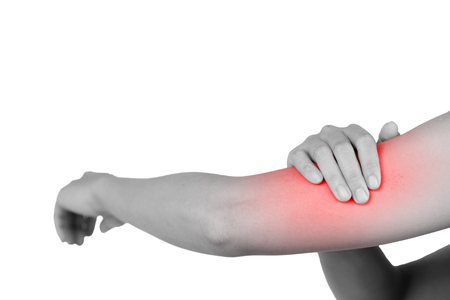 Inflammation colored in red suffering from pain in a elbow, healthcare and problem concept - isolated on white background with clipping path.の写真素材