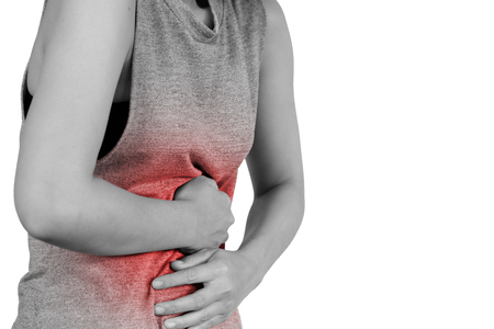 Inflammation colored in red suffering. stomach painful suffering from stomachache causes of menstruation period, gastric ulcer, appendicitis or gastrointestinal system disease. Healthcare and health insurance concept - isolated on white background with clipping path.の写真素材