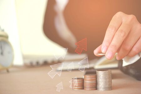 businessman hand working with new modern computer on office table, smart phone and Coin, business strategy as concept.の写真素材