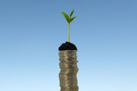 money stack step up growing growth saving money, While seedlings are growing on pile of coins. ideas about saving money for future use - business success concept.の素材 [FY310148237848]