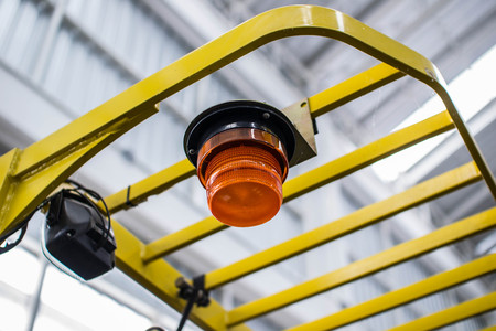 Emergency warning light, attached to a forklift truck.の写真素材