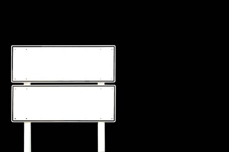 Isolated blank white double roadsign pole on black backgroundの写真素材
