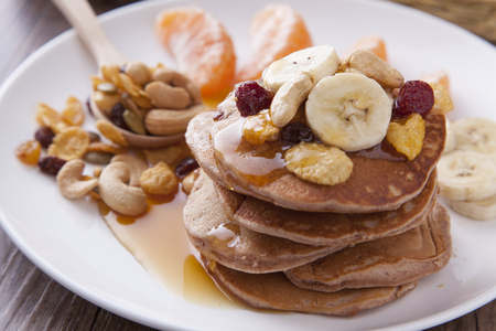 Close up pancake with banana, strawberry and cornflakesの写真素材