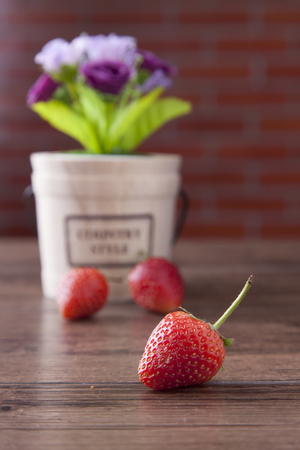 Red strawberry on wood tableの写真素材