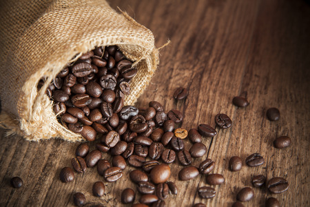 Close-up coffee and sack on wood table.Photo with natural lightの写真素材