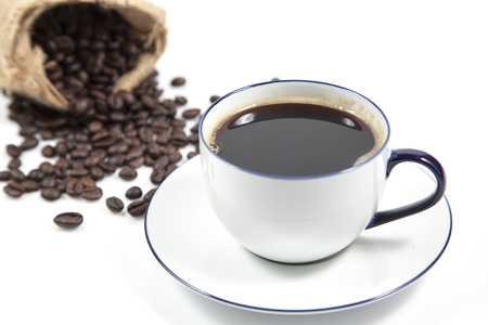 Coffee in white cup and blur coffee seed in sack for background, Isolate imageの写真素材