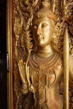 Golden angel statue on the door