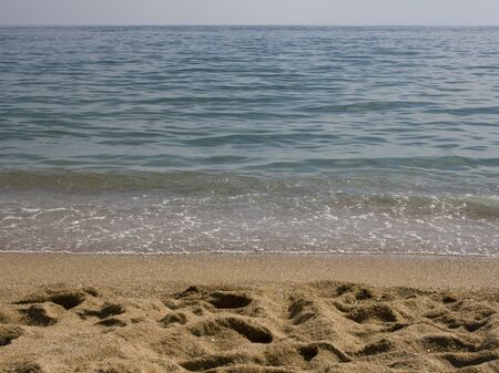 Gentle waves breaking on a Black Sea beachの写真素材