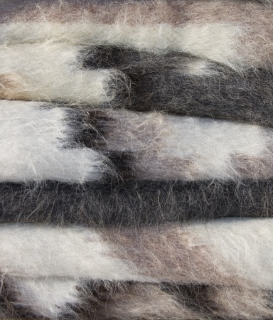 Homemade sheep blankets selling on the market stand, close up