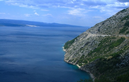 Blue sea, mountain, island and road in Croatiaの写真素材