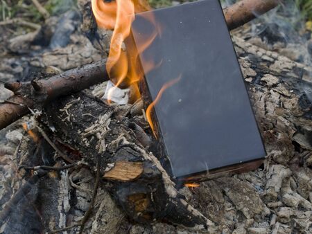 Black box/book burning in a fireの写真素材