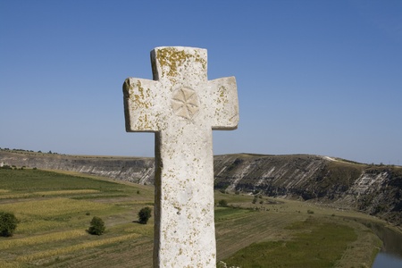 Stone cross on the hill in Orhei Vechi, Moldova.の写真素材