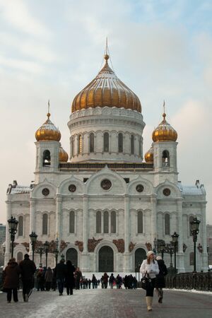 Moscow, Russia - January 03, 2011 - People walking through footbridge over Moscow River in front of Cathedral of Christ the Savior at cold winter day.のeditorial素材