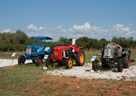 Nova Vas, Croatia - August 02: Stihl, Eicher and Hanomag antique tractors on display at The Exhibition Of Old Tractors And Display Of Items About Bread, Oil And Wine.のeditorial素材